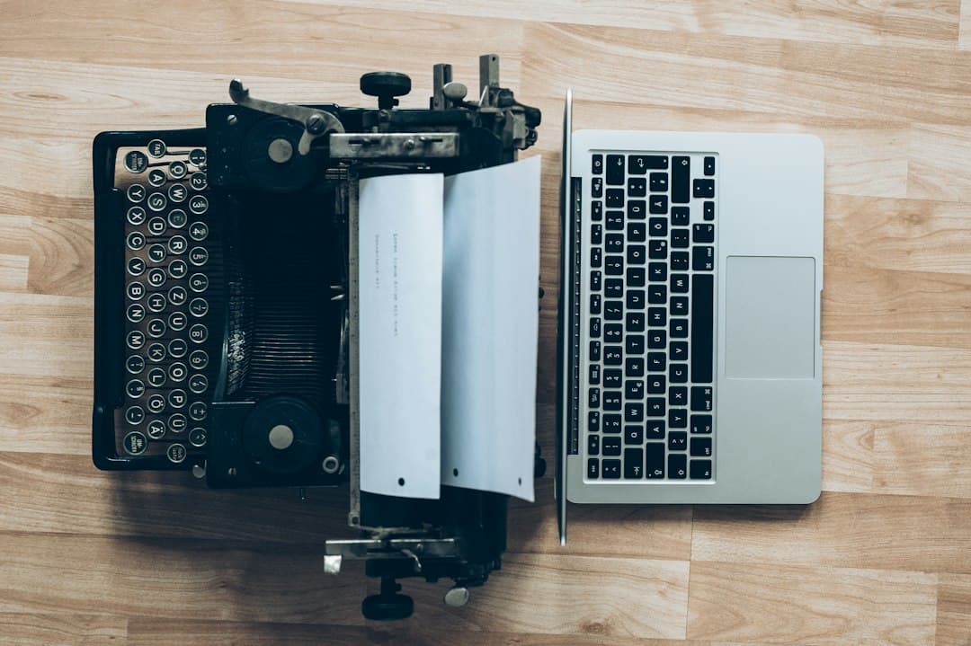 Gray typewriter and MacBook